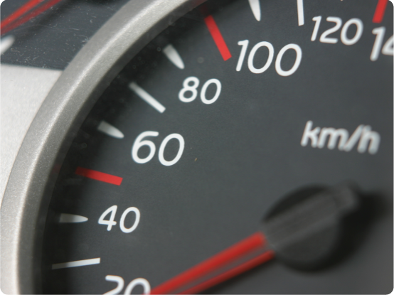 A close up of a car's speedometer